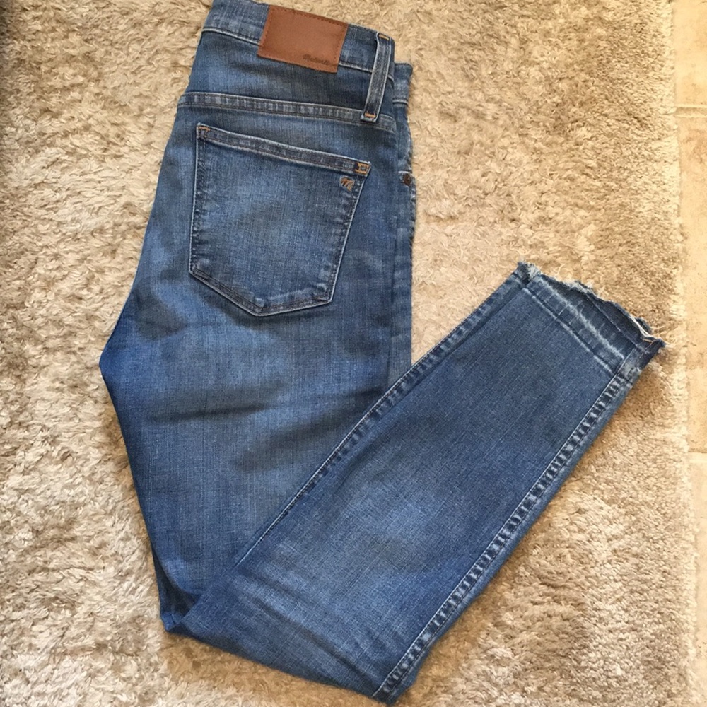 Madewell rip knee jean with distressed bottoms